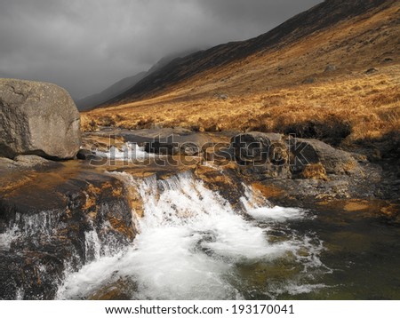 Mountain stream in Glen Rosa towards Goat Fell on the Isle of Arran in western Scotland in the United Kingdom