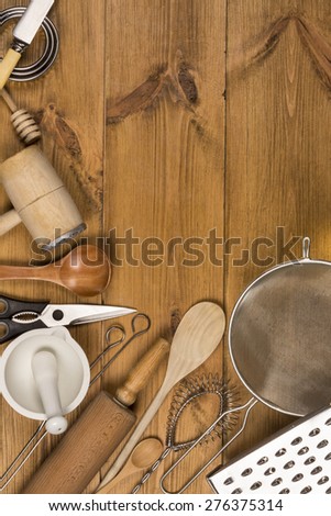 A selection of Kitchen Utensils on a farmhouse kitchen table - with Space for Text