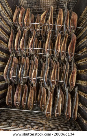 Smoked fish - fish that has been cured by smoking. Originally this was done as a preservative. In more recent times smoking of fish is generally done for the unique taste and flavor.