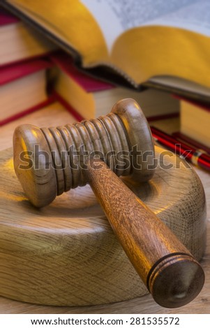 A gavel is a small ceremonial mallet which an auctioneer, a judge, or the chair of a meeting hits a surface to call for attention or order.