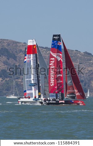 SAN FRANCISCO, CA - AUGUST 26: New Zealanders team and the Chinese team try to overtake the American team in the bay of San Francisco during the final of the America\'s Cup 2012. Aug 26 2012