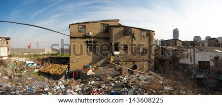 Poor buildings in front of modern Shanghai, Garbage everywhere, on the road to Shanghai
