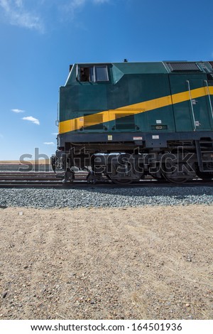 View of the locomotive of the Shanghai - Lhasa train stopped in a train station in Tibet. China 2013.