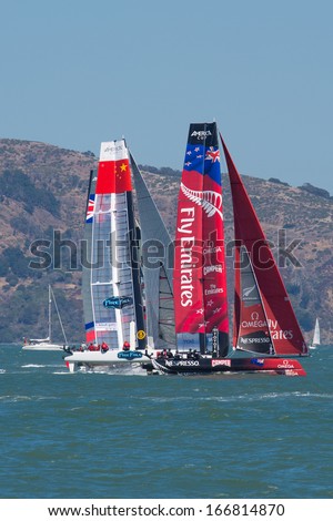 SAN FRANCISCO, CA, AUGUST 26: New Zealander team and the Chinese team try to overtake the American team in the bay of San Francisco during the final of the America\'s Cup 2012.