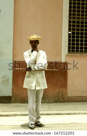 HAVANA, CUBA, MAY 15: Unidentified Man posing with his wood stick and dressed in a traditional cuban costime at  La Havana, 2004.