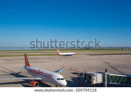 VENICE, ITALY - JUNE 09: Planes parked at the passenger terminal of Marco Polo Airport, Venice on June 09, 2014. The airport is popular with tourists to the region.