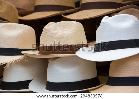 Group of brown hats for sale, hanging on a wall, Otavalo Market. Ecuador