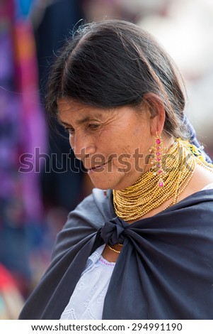 OTAVALO, ECUADOR - FEB 28: Unidentified Ecuadorian old woman at the Otavalo Market. Most of the Ecuadorian people belong to the Mestizo ethnic group, famous for their art and music. Ecuador 2015.