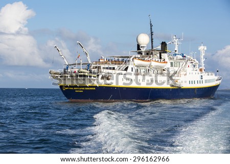 PUERTO AYORA, GALAPAGOS, FEBRUARY 13: National Geographic Endeavour ship seen cruising in the bay of Santa Cruz Island in the Galapagos Islands. Ecuador 2015.