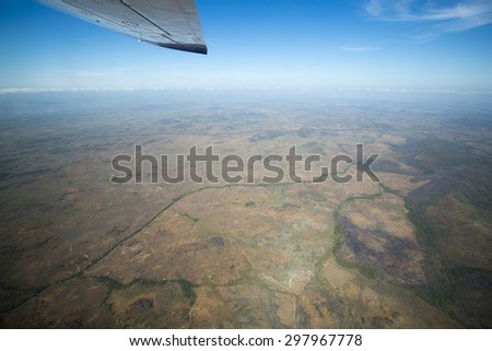 Aerial view of the land and blue sky on the way to Ciudad Bolivar by small plane. Venezuela