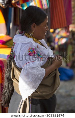 OTAVALO, ECUADOR - FEB 28, 2015: Unidentified Ecuadorian old woman at the Otavalo Market. Most of the Ecuadorian people belong to the Mestizo ethnic group, famous for their art and music. Ecuador.