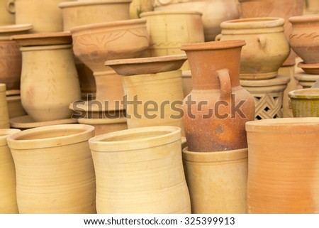 Handmade moroccan clay dishware in a pottery shop near Tiznit, in Morocco
