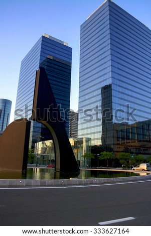 BRUSSELS, BELGIUM, JUNE 12: Modern sculpture with office buildings in the center of the financial and business district in Brussels with sunset. Belgium 2006