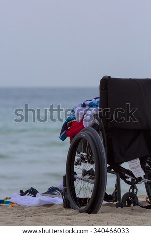 MIAMI, FL, AUGUST 23: Empty wheel chair standing on the beach of Miami Beach in Florida.