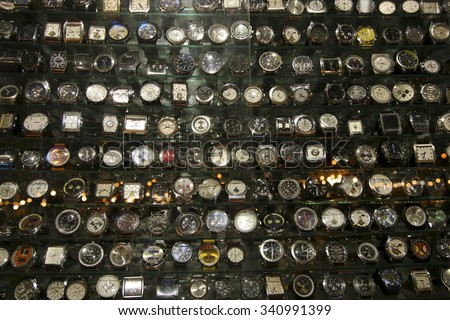 MARRAKESH, MOROCCO, SEP 19: Group of Fake watches displayed in a retail shop in the market of the traditional Medina in Marrakesh at night. Morocco 2006