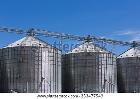 SAN RAMON, URUGUAY, NOV 25: Group of aluminium grain silos on a farm in San Ramon with a blue sky, Uruguay 2014