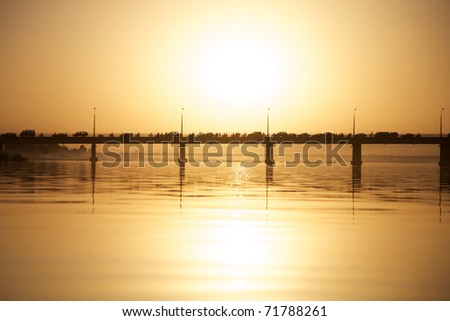 Pont des martyrs Bridge in Bamako on the river the Niger with a beautiful sunset with people, cars and motorbikes