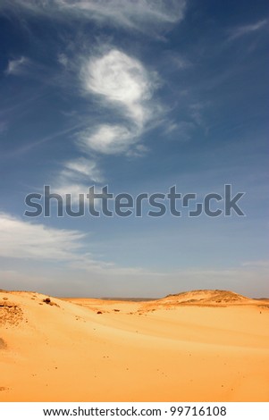 Sandy and deserted landscape in the Libyan desert.