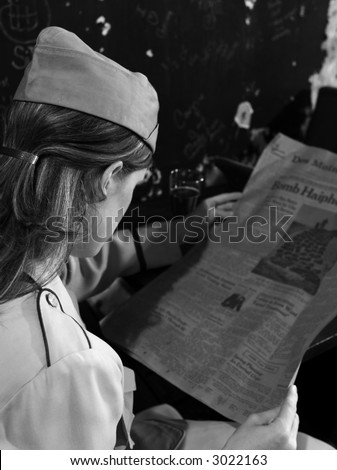 Military Nurse reading newspaper about war while on Leave (Retro Photograph) in the style of Life Magazine