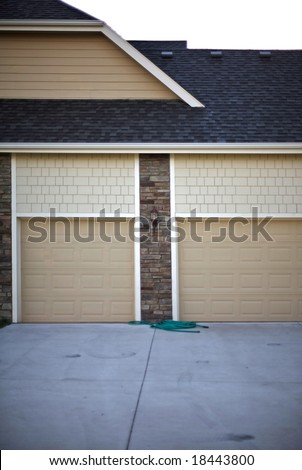 Suburban garage doors indicating at least a two car garage typical expectations of a \