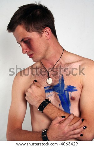 stock photo Naked gothic man with cross painted on his chest
