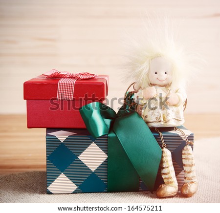 Xmas card, gift boxes and toy angel