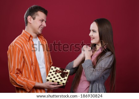 Boy gives present to girl