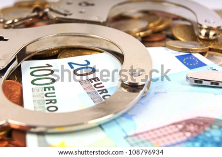 Handcuffs and Euro Money / economic fraud