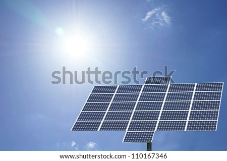 solar panel with sun and blue sky / solar panel