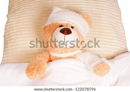 Teddy Bear with Bandage lying in the bed / Teddy Bear