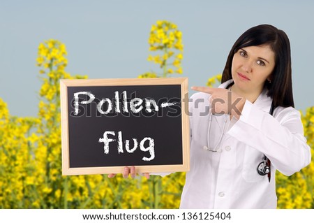 Doctor with sign and the german words pollen flight / pollen flight