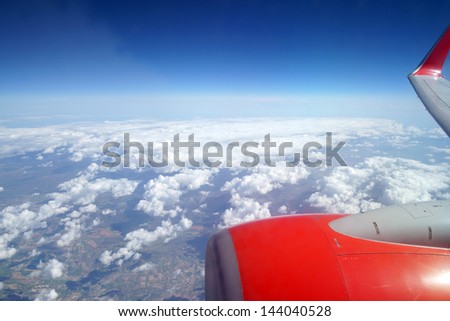 Photographed clouds from a plane / plane and clouds