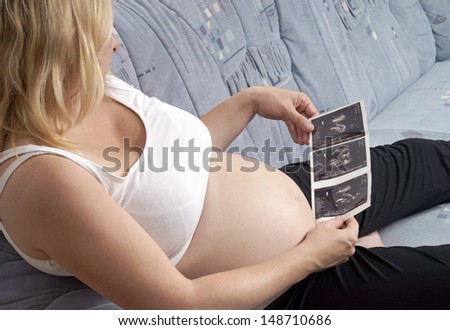 pregnant woman with ultrasound picture / pregnancy