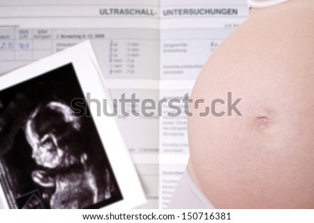 pregnant woman with mother pass and ultrasound image / pregnancy
