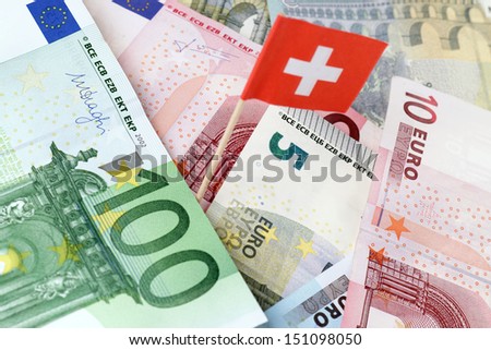 euro banknotes with swiss flag / tax evasion