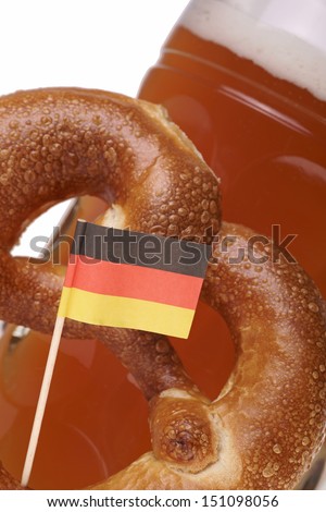 Beer mug with wheat beer and pretzel / german traditions