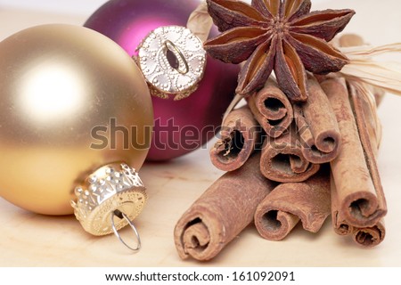 Christmas baubles with cinnamon sticks and star anise / christmas time