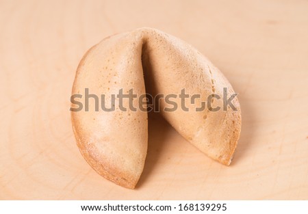 fortune cookie over a wooden board / Fortune Cookies