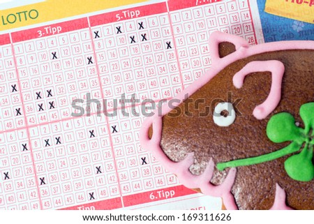 Lucky pig with lottery ticket / lottery