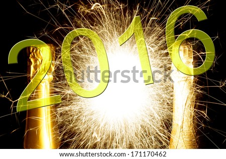 champagne bottle with fireworks and the year number 2016 / New year 2016