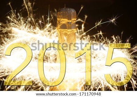 Champagne bottle with fireworks and the year number 2015 / New year 2015