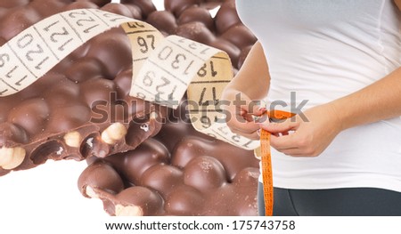 Woman with tape measure and chocolate / Diet