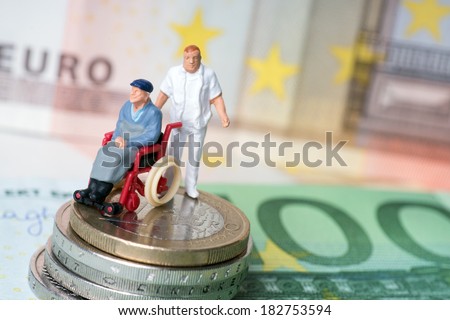Wheelchair user with nursing staff and money / wheelchair user