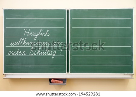 school blackboard with the german words Welcome to the first day of school / Chalkboard
