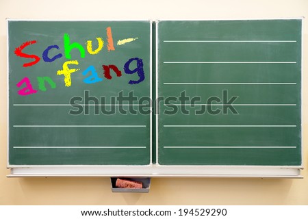 school blackboard with the german words starting school / Chalkboard