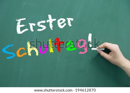 school blackboard with the german words first day of school / starting school