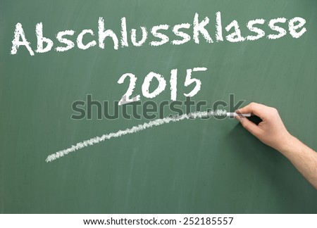 Chalkboard with the german words graduating class 2015 / graduating class