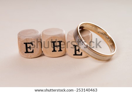 wooden cubes with the german word marriage / Marriage