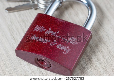 Padlock with the german words we three for ever and ever / Love