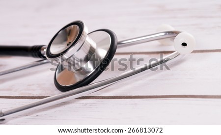 Stethoscope on wooden background / Stethoscope